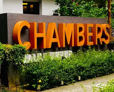 a large orange sign on the side of a building at Chambers Residence Specious Suites KlCC in Kuala Lumpur