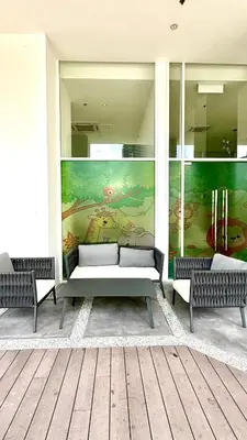 a room with two benches and a mural on the wall at Kuala Lumpur Quill Residences By AR Stay in Kuala Lumpur