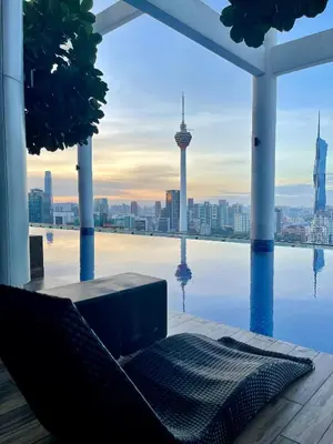 a view of the city from a swimming pool at The Colony SkyView KLCC by Alaman in Kuala Lumpur