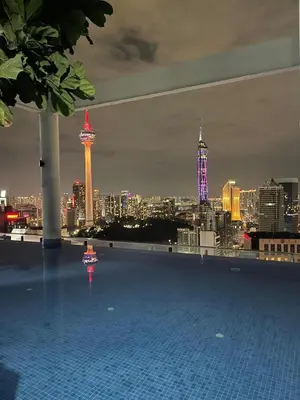 a rooftop swimming pool with a view of the city at The Colony SkyView KLCC by Alaman in Kuala Lumpur