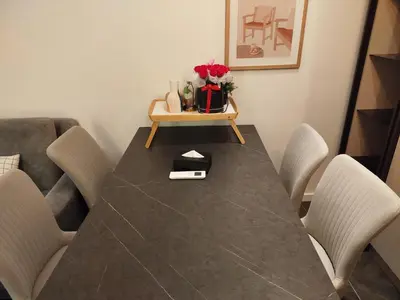 a dining room with a table and chairs at Scarletz suites Klcc by Sunlight in Kuala Lumpur
