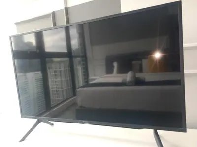 a television screen with a bed in a room at Scarletz suites Klcc by Sunlight in Kuala Lumpur