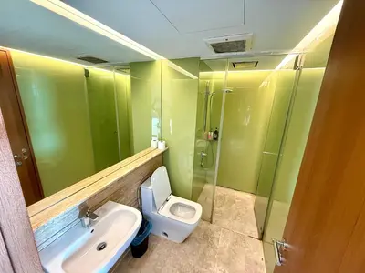 a bathroom with a toilet and a sink and a shower at SKY SUiTES KLCC BY RT GROUP in Kuala Lumpur