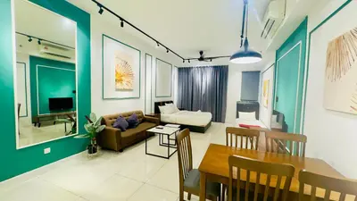 a living room with a table and a couch at Chamber Residence KlCC by Royal Empire in Kuala Lumpur