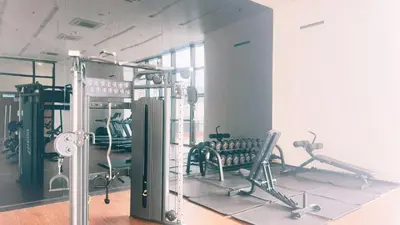 a gym with chairs and machines in a room at Chamber Residence KlCC by Royal Empire in Kuala Lumpur