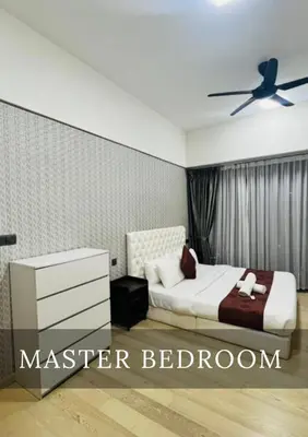 a bedroom with a bed and a ceiling fan at Metro Star KLCC Living in Kuala Lumpur