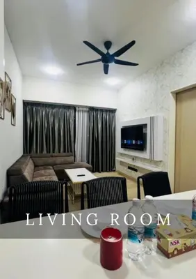 a living room with a couch and a ceiling fan at Metro Star KLCC Living in Kuala Lumpur