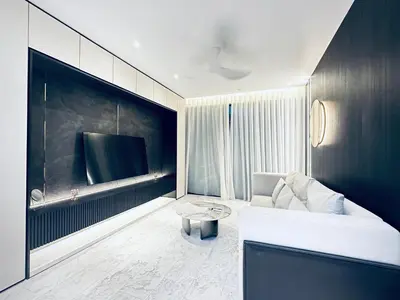 a living room with a couch and a tv at Eaton Residences By Tropika KLCC in Kuala Lumpur