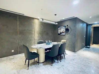 a dining room with a table and chairs at Eaton Residences By Tropika KLCC in Kuala Lumpur