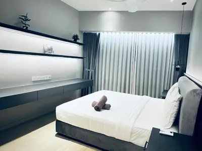 a bedroom with a bed with a teddy bear on it at Eaton Residences By Tropika KLCC in Kuala Lumpur
