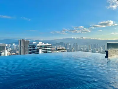 a pool on the roof of a building with a city at Eaton Residences By Tropika KLCC in Kuala Lumpur