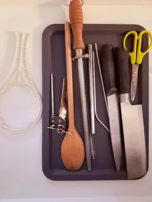 a tray with various kitchen utensils on a table at Relax and cozy, entire unit in Kuala Lumpur