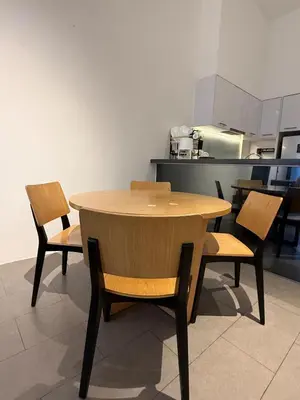 a wooden table and chairs in a kitchen at Relax and cozy, entire unit in Kuala Lumpur