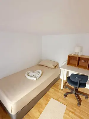 a bedroom with a bed and a desk and a chair at Relax and cozy, entire unit in Kuala Lumpur