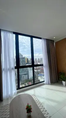 a room with a large window with a view of a city at Majestic Premium Residence Suites KLCC by Alaman in Kuala Lumpur