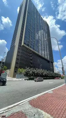 a large building with a car parked in front of it at Majestic Premium Residence Suites KLCC by Alaman in Kuala Lumpur