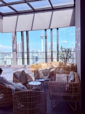a room with chairs and tables and a large window at Luxury Dream Home At Axon Residence Bukit Bintang Klcc pavilion in Kuala Lumpur