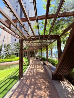 a covered walkway with benches in a park at Luxury Dream Home At Axon Residence Bukit Bintang Klcc pavilion in Kuala Lumpur