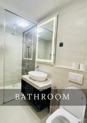 a bathroom with a sink and a toilet and a mirror at Urban Star Residence KLCC in Kuala Lumpur