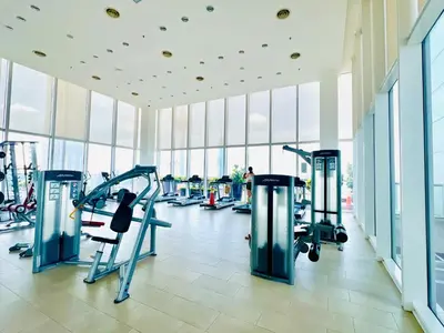 a gym with treadmills and machines in a building at The Grand klcc at platinum face in Kuala Lumpur