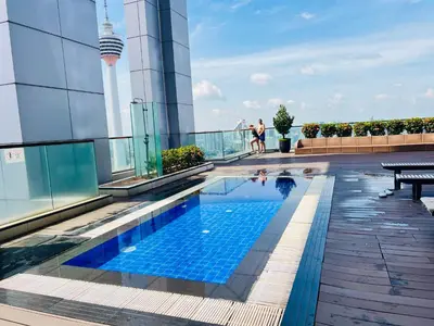 a swimming pool on the roof of a building at The Grand klcc at platinum face in Kuala Lumpur
