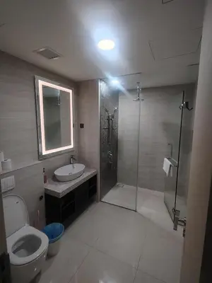 a bathroom with a shower and a toilet and a sink at KL Suites At Star KLCC in Kuala Lumpur