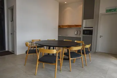 a dining room with a table and chairs at Glowing Star Home Infinity Swimming Pool By Lalaport in Kuala Lumpur