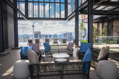 a patio with furniture and a view of the city at Glowing Star Home Infinity Swimming Pool By Lalaport in Kuala Lumpur