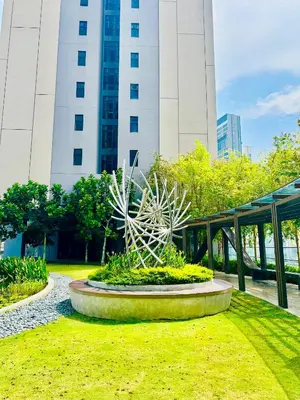 a sculpture in a park in front of a building at Luxury Residence At Axon in Kuala Lumpur