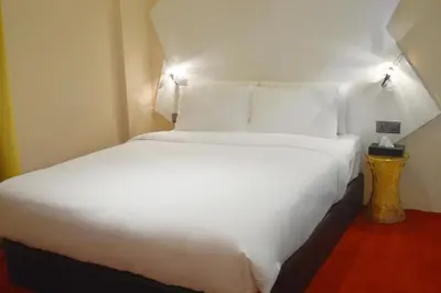 a large white bed in a hotel room at Melange Boutique Hotel Bukit Bintang in Kuala Lumpur