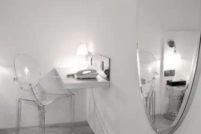 a white bathroom with a sink and a mirror at Melange Boutique Hotel Bukit Bintang in Kuala Lumpur