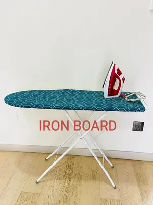 a iron board sitting on top of a bed at Star Residences Suites Home in Kuala Lumpur