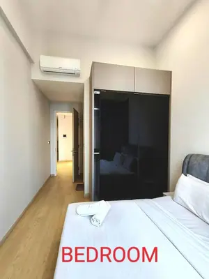 a bedroom with a bed and a room with a bathroom at Star Residences Suites Home in Kuala Lumpur