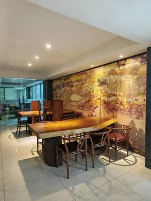 a dining room with a large mural on the wall at City Comfort Hotel Kuala Lumpur City Center (Bukit Bintang) in Kuala Lumpur