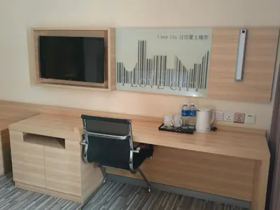 a desk with a chair and a television in a room at City Comfort Hotel Kuala Lumpur City Center (Bukit Bintang) in Kuala Lumpur