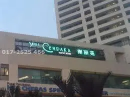 a sign on the top of a building at Richone Maluri Private Hotel in Kuala Lumpur