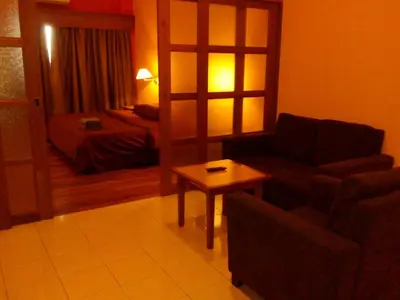 a living room with a couch and a table at Richone Maluri Private Hotel in Kuala Lumpur