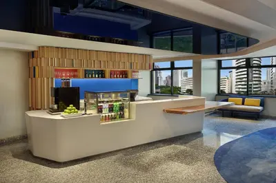 a bar in a building with a view of the city at Holiday Inn Express Kuala Lumpur City Centre by IHG in Kuala Lumpur