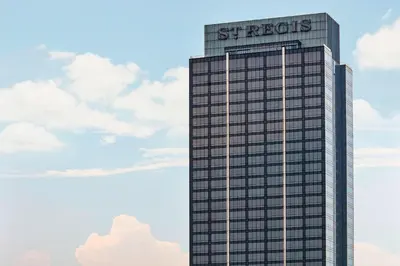 a building with a sign on the top of it at The St. Regis Kuala Lumpur in Kuala Lumpur
