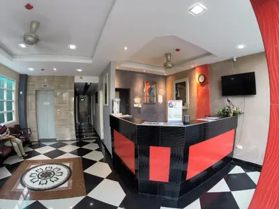 a hotel lobby with a black and red bar at Adamson Park Kuala Lumpur in Kuala Lumpur