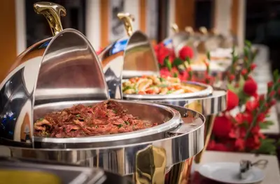a row of plates of food on a table at Hotel Sentral Kuala Lumpur at KL Sentral Station in Kuala Lumpur