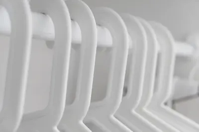 a row of white chairs sitting next to each other at Parkview KLCC Serviced Suites in Kuala Lumpur
