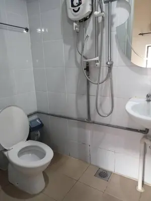 a bathroom with a toilet and a sink at Birdnest Guesthouse, Gaia Rooftop Cafe in Kuala Lumpur