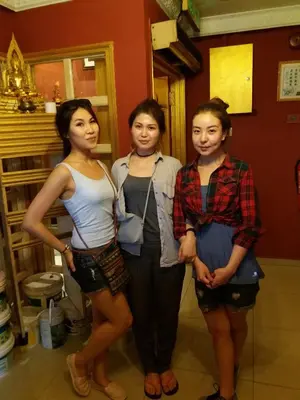 three girls posing for a picture in a room at City Inn Hotel in Kuala Lumpur