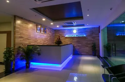 a lobby with a reception desk in a building at Lavana Hotel, Chinatown in Kuala Lumpur