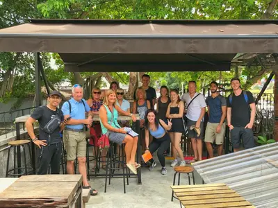 a group of people posing for a picture under a canopy at Chinatown Hostel by Mingle - Rooftop Private Jacuzzi with Bar in Kuala Lumpur