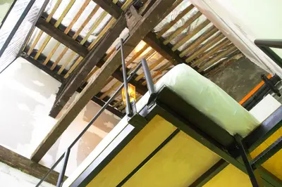 an overhead view of a staircase in a building at Chinatown Hostel by Mingle - Rooftop Private Jacuzzi with Bar in Kuala Lumpur
