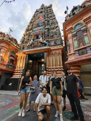 a group of people standing in front of a temple at Chinatown Hostel by Mingle - Rooftop Private Jacuzzi with Bar in Kuala Lumpur