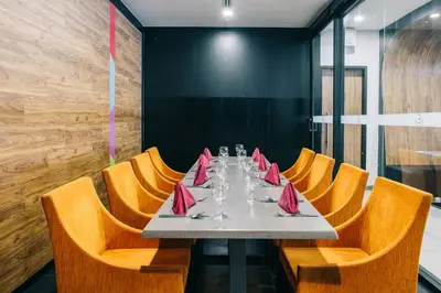 a dining room with a table and chairs at Oakwood Hotel & Residence Kuala Lumpur in Kuala Lumpur