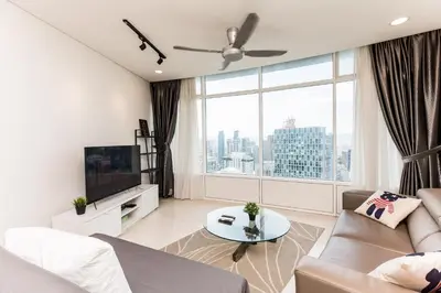 a living room with a couch and a large window at Vortex KLCC by Luxury Suites Asia in Kuala Lumpur